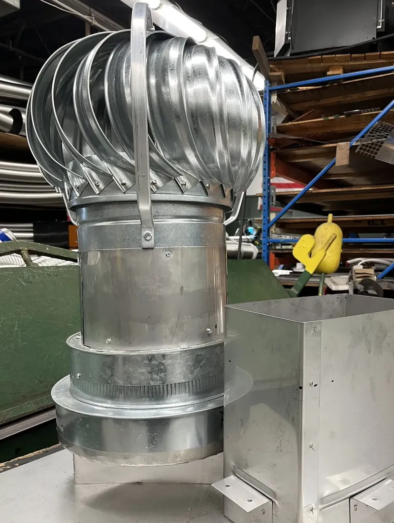 Turbine vent cap on a commercial chimney